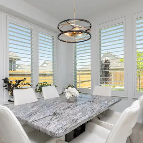 marble-top Breakfast table with a bright view of the back yard 